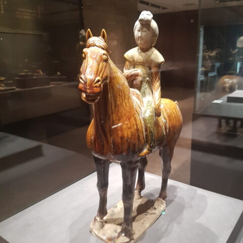 A woman riding a horse in the Tang dynasty